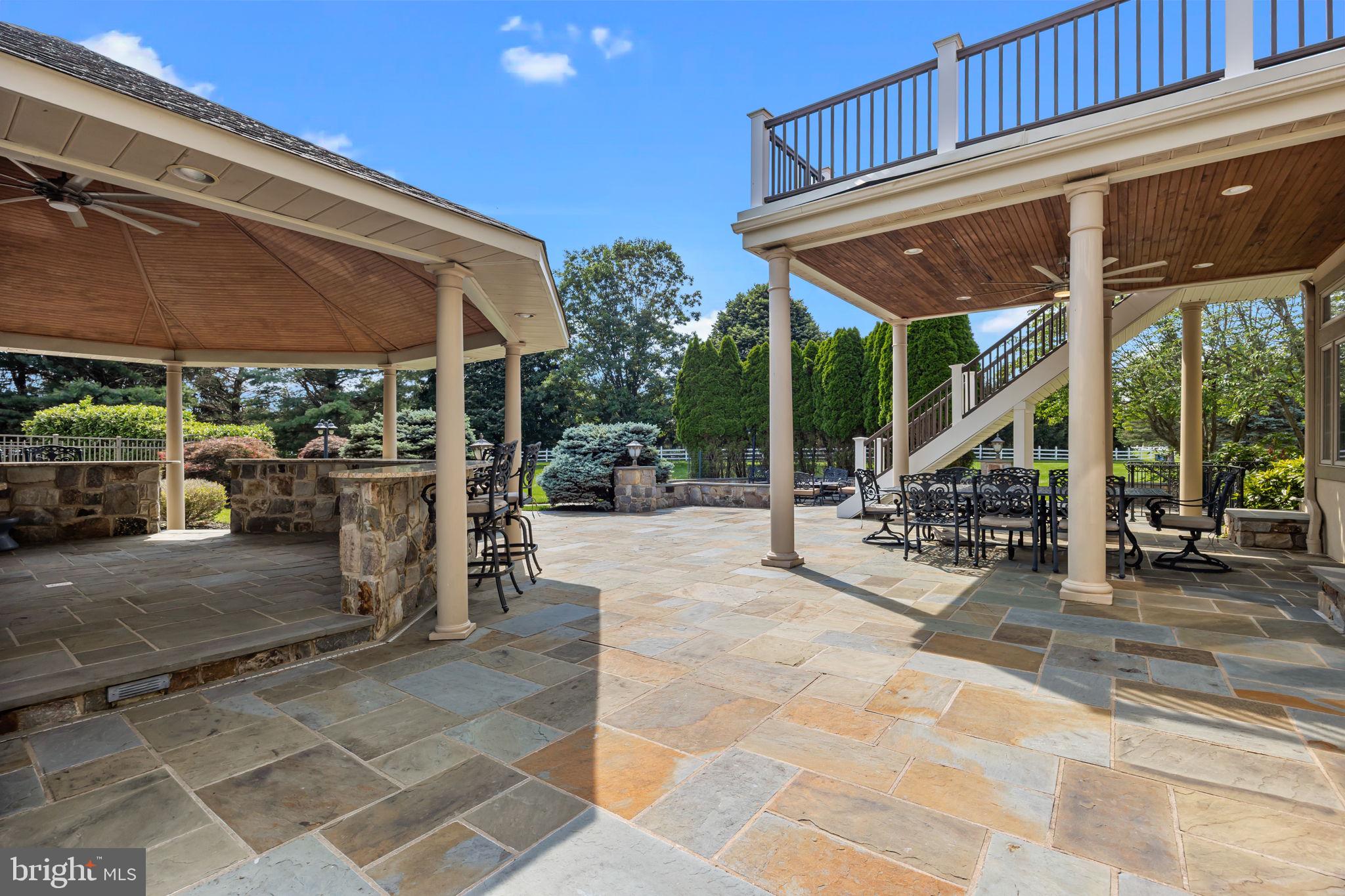 2 Aldans Way Newtown, PA 18940 - Photo 75 of 100 a view of a patio with a table and chairs under an umbrella