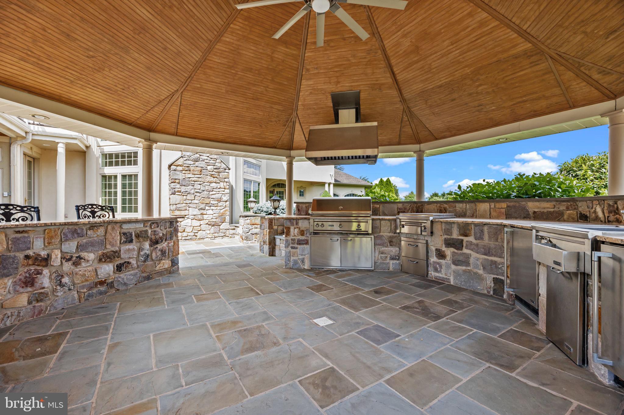 2 Aldans Way Newtown, PA 18940 - Photo 76 of 100 a view of a patio with table and chairs under an umbrella