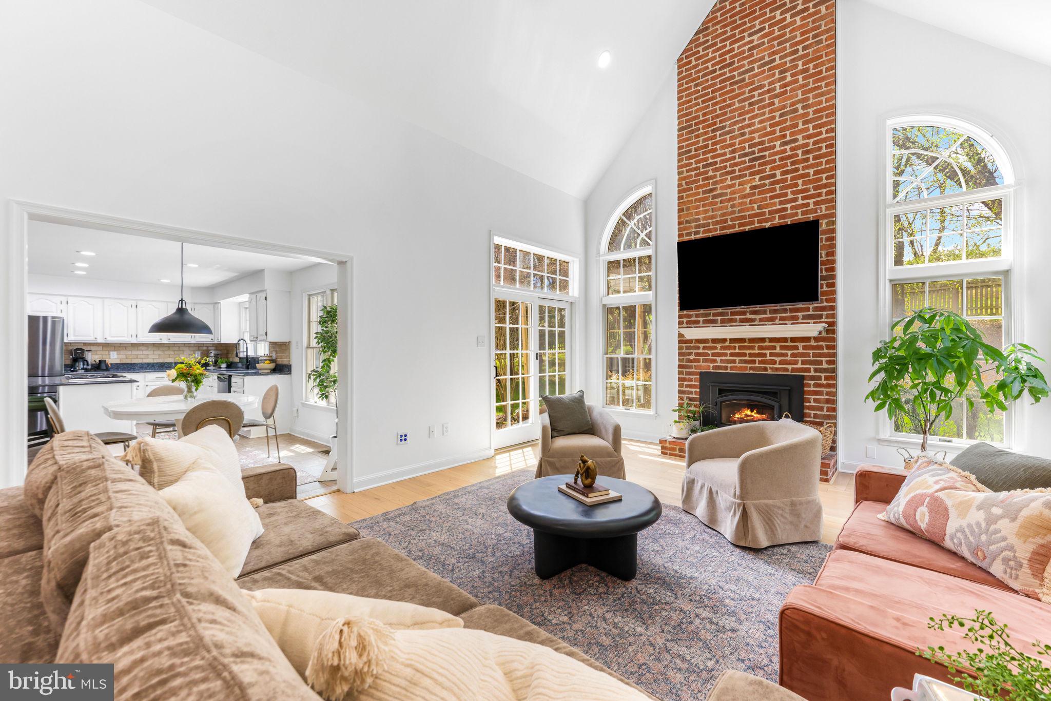 a living room with furniture fireplace and a flat screen tv