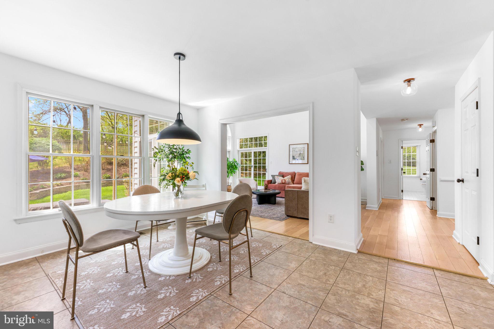 6513 Apple Blossom Ride Columbia, MD 21044 - Photo 20 of 115 a view of a dining room with furniture window and wooden floor