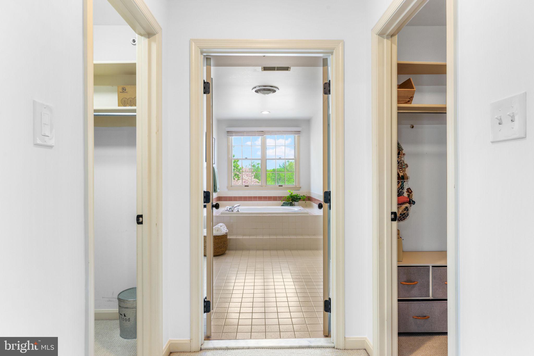 6513 Apple Blossom Ride Columbia, MD 21044 - Photo 45 of 115 a view of a hallway with wooden floor and a living room