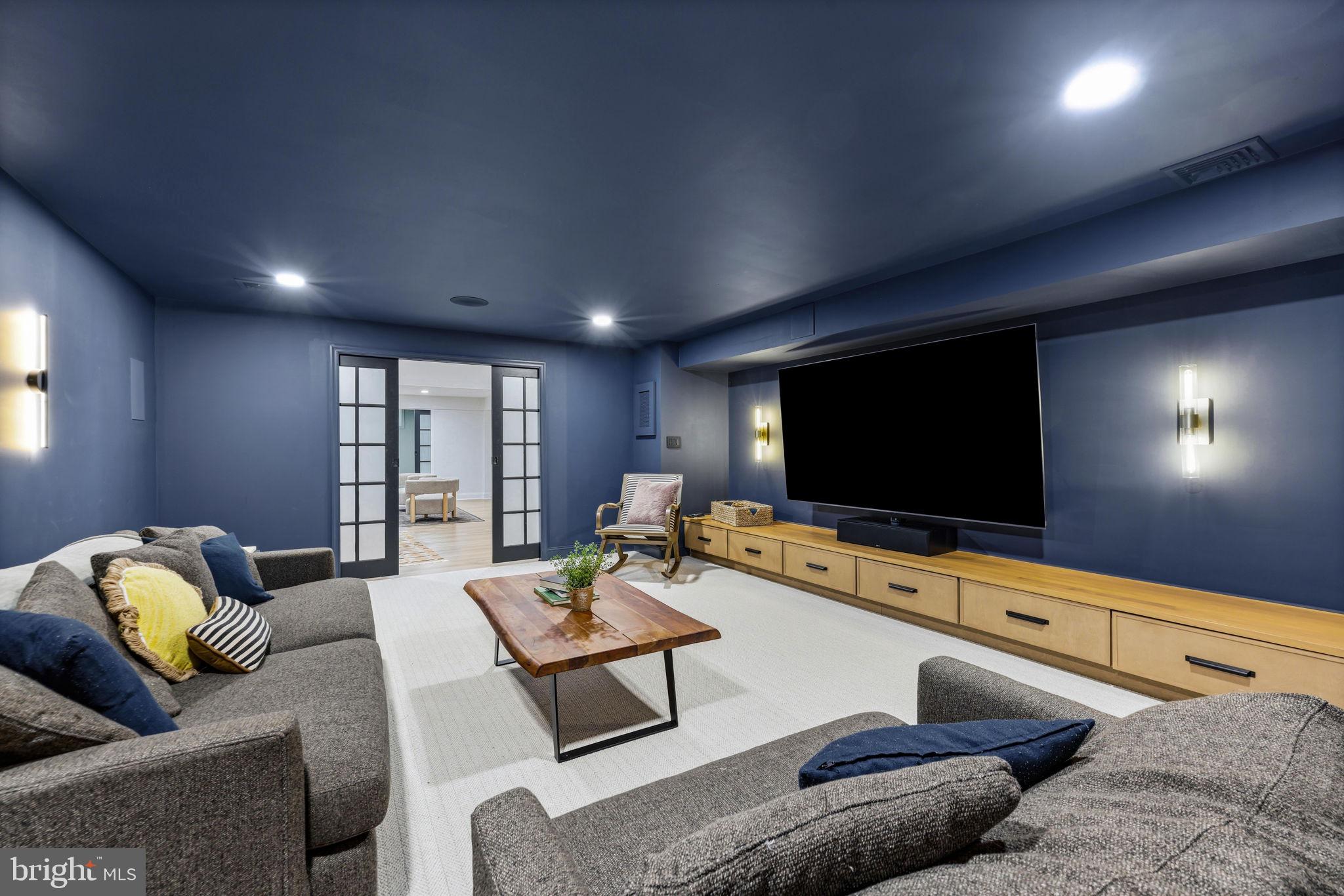 6513 Apple Blossom Ride Columbia, MD 21044 - Photo 74 of 115 a living room with furniture and a flat screen tv