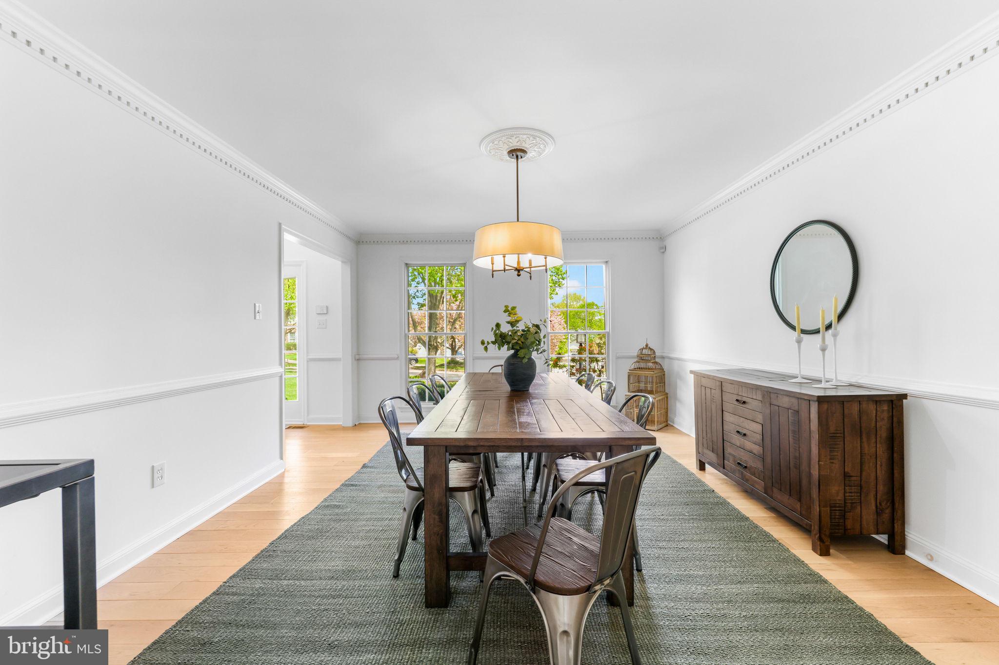 6513 Apple Blossom Ride Columbia, MD 21044 - Photo 9 of 115 a view of a dining room with furniture window and wooden floor