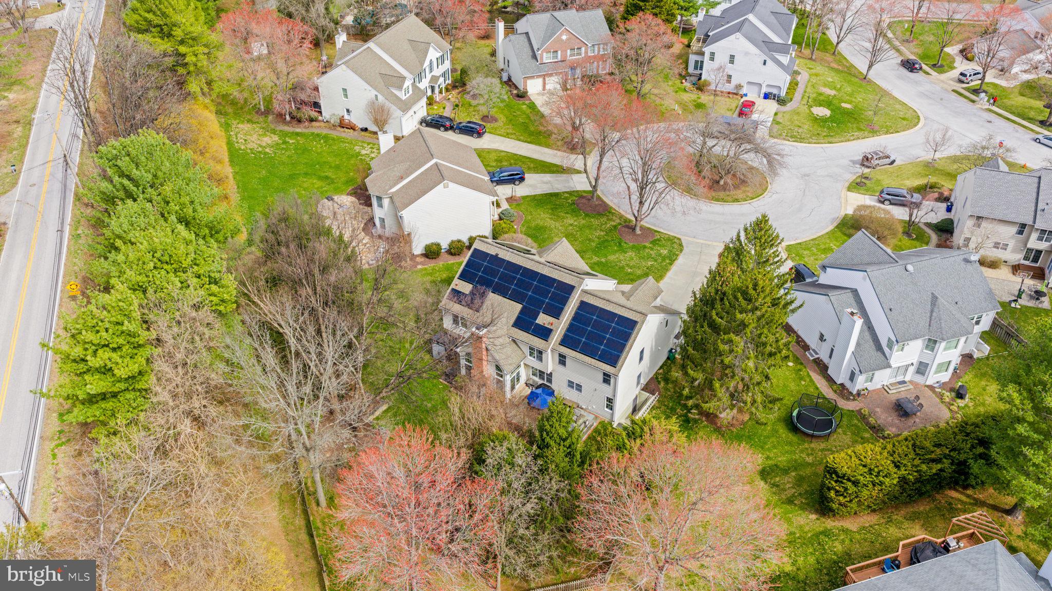 6513 Apple Blossom Ride Columbia, MD 21044 - Photo 97 of 115 an aerial view of a house with a yard and swimming pool