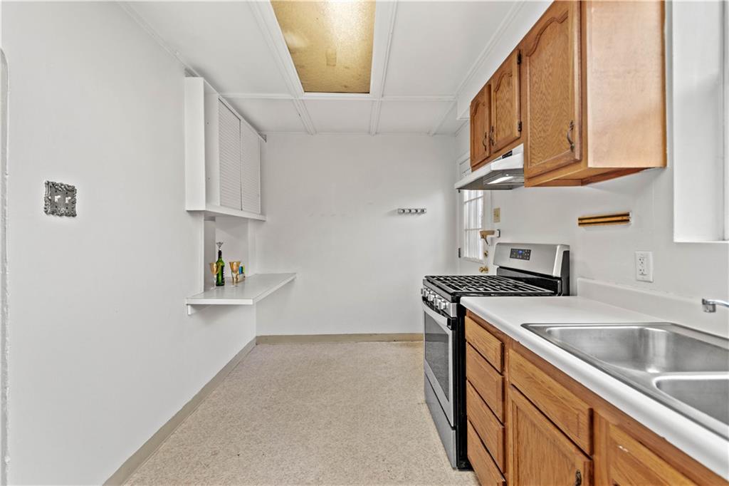 2927 Willett Road Pittsburgh, PA 15227 - Photo 14 of 24 a kitchen that has a sink and a stove