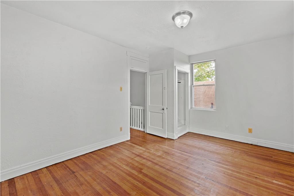2927 Willett Road Pittsburgh, PA 15227 - Photo 16 of 24 an empty room with wooden floor and windows