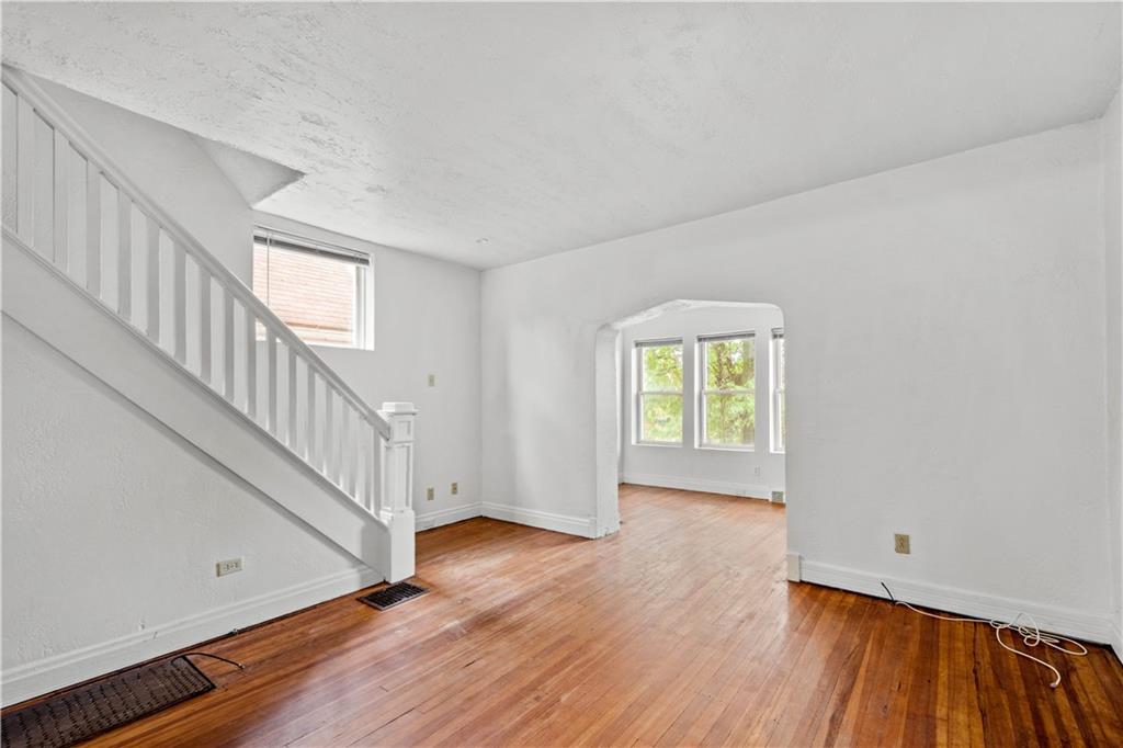 2927 Willett Road Pittsburgh, PA 15227 - Photo 5 of 24 a view of an empty room with wooden floor and a window