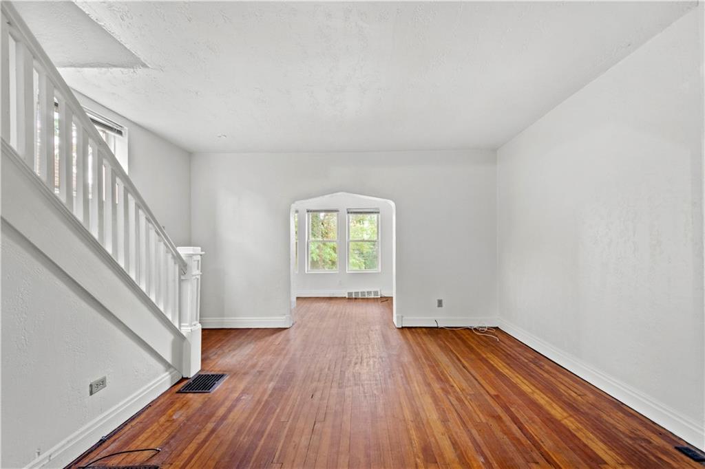 2927 Willett Road Pittsburgh, PA 15227 - Photo 6 of 24 wooden floor in an empty room with a window