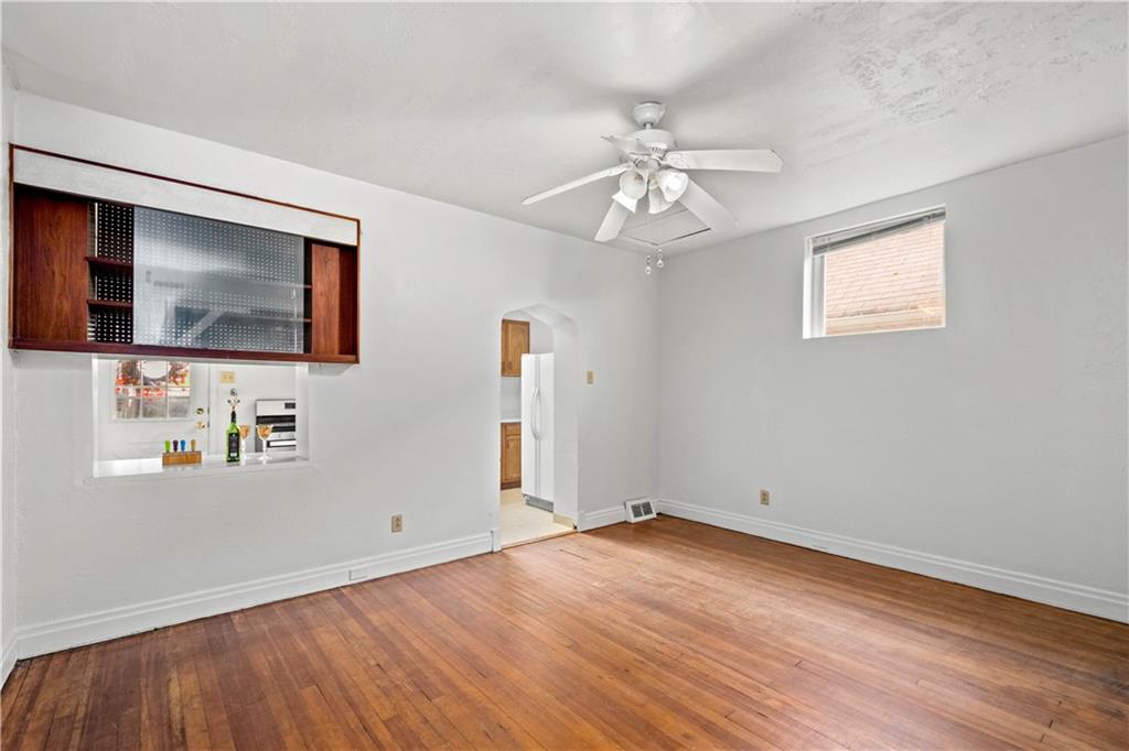 2927 Willett Road Pittsburgh, PA 15227 - Photo 9 of 24 wooden floor in an empty room with a window