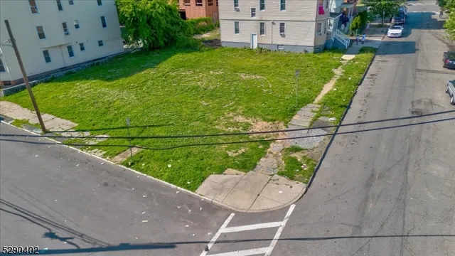 a view of a two chairs in the back yard