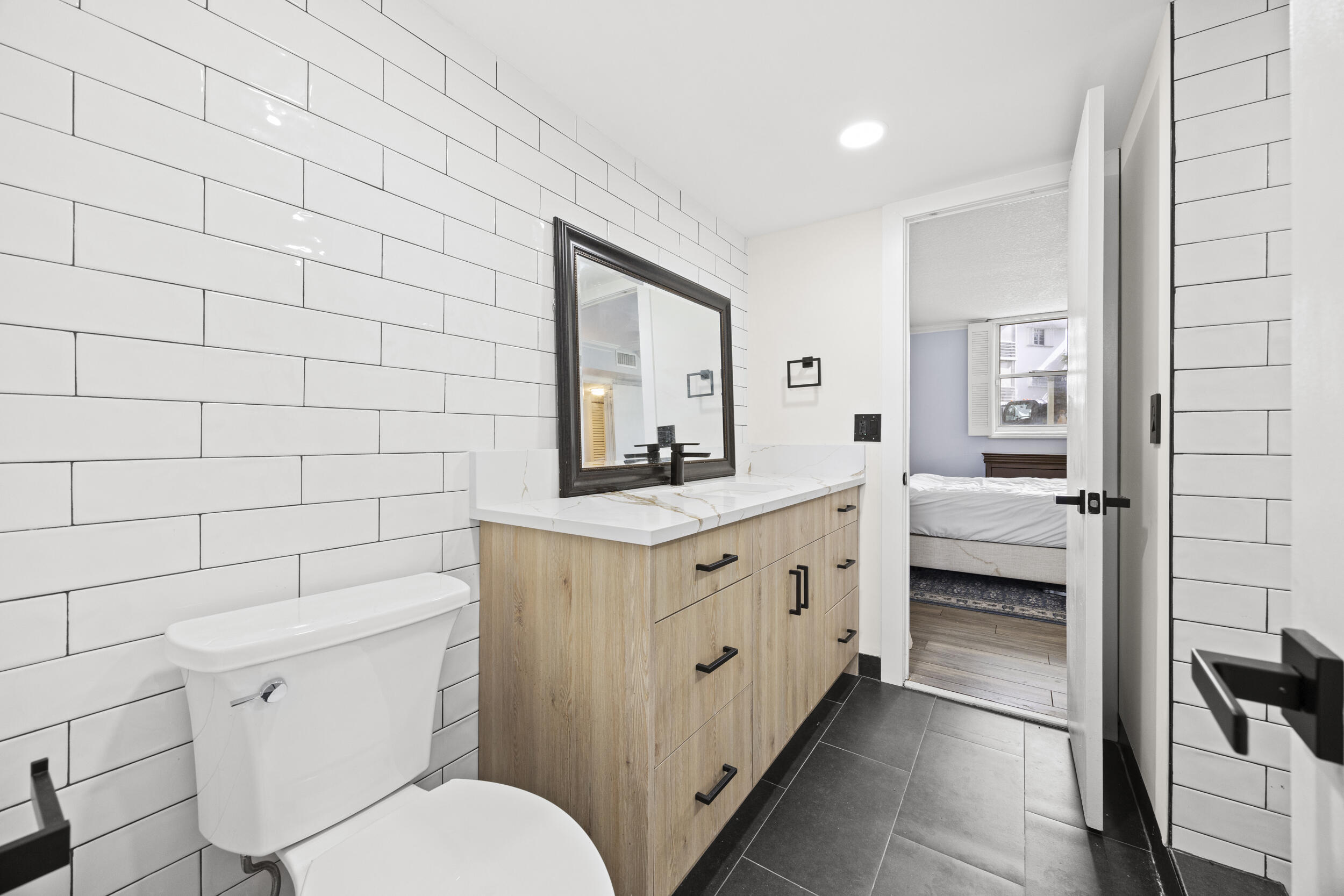 5301 Northwest 2nd Avenue, Unit 1010 Boca Raton, FL 33487 - Photo 28 of 35 Guest Bathroom