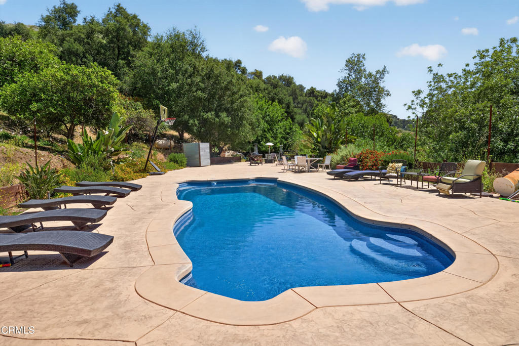 8416 Wheeler Canyon Road Santa Paula, CA 93060 - Photo 35 of 48 a view of a swimming pool with an outdoor space