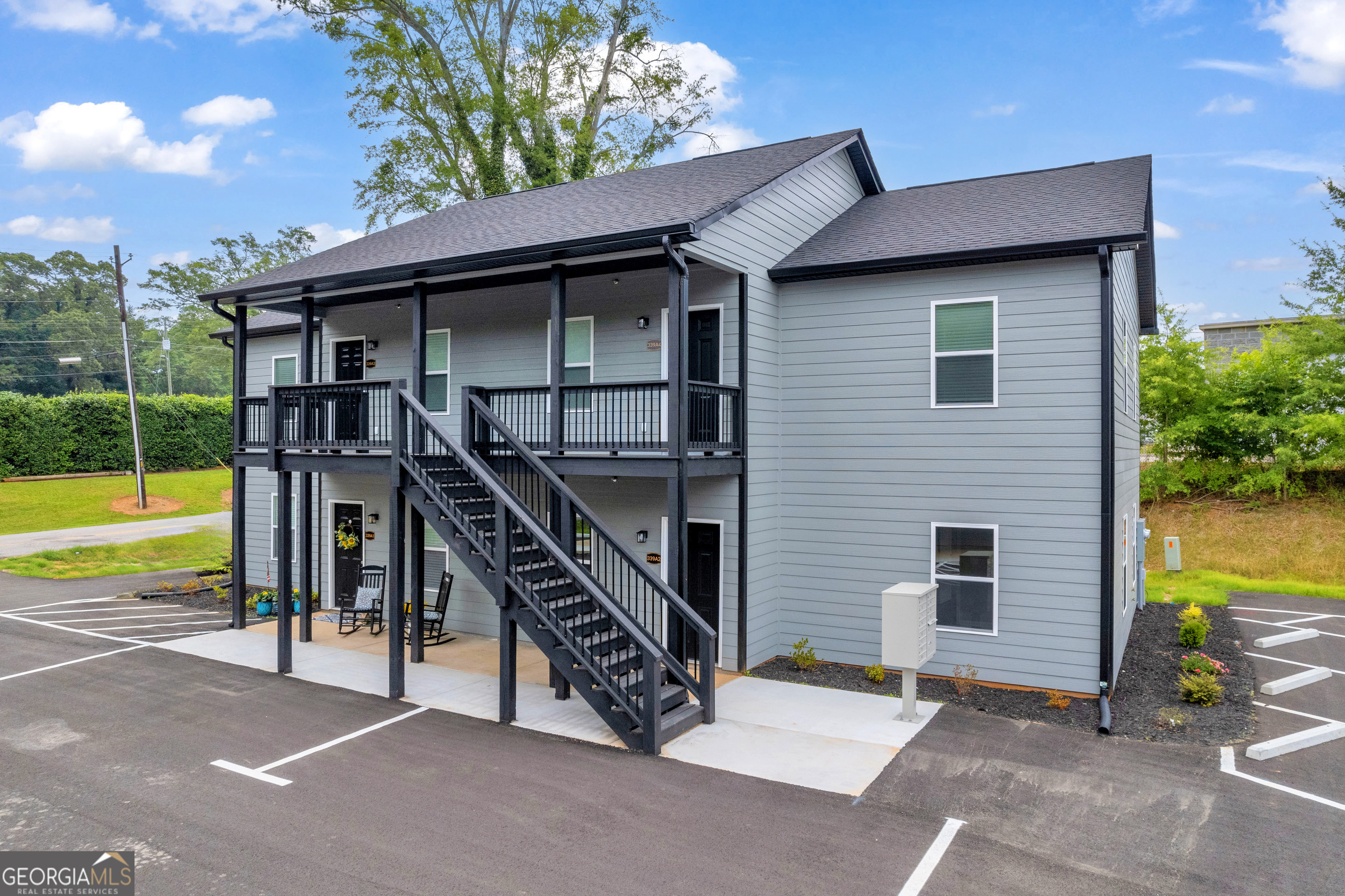 339 A Gainesville Street Carnesville, GA 30521 - Photo 19 of 19 a view of a house with a backyard and a large tree