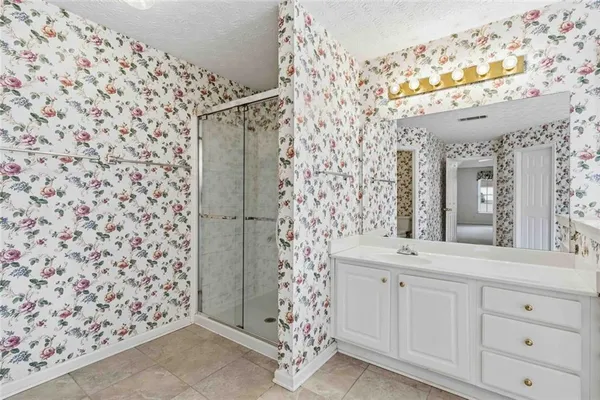 a view of a house with a backyard and a garage