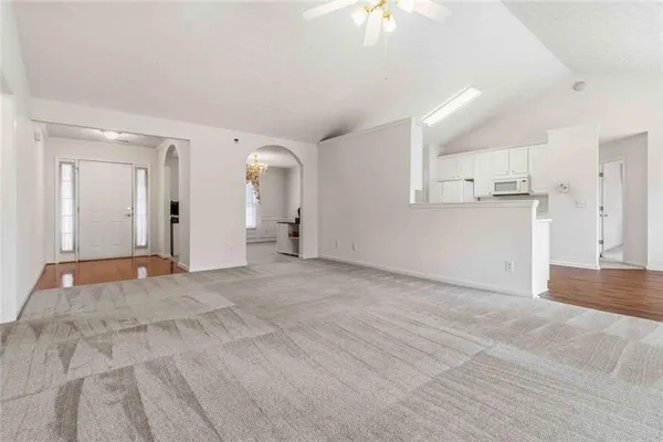 a view of an empty room with a window