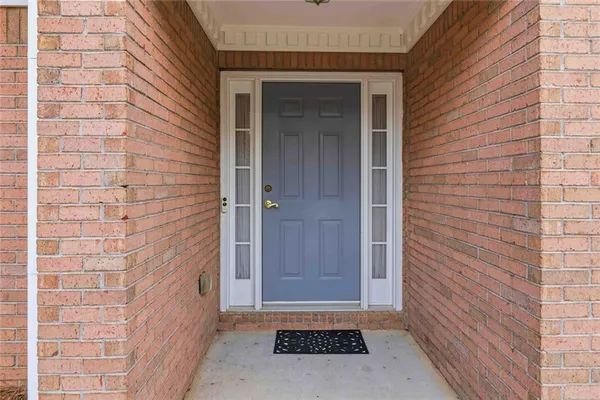 a view of an empty room with a fireplace