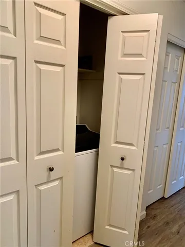 a view of an entryway with wooden floor