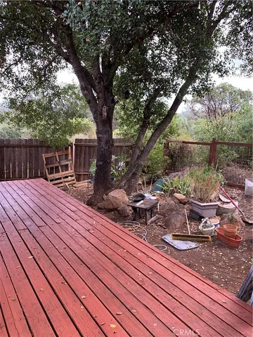 a view of a chairs and tables on the wooden roof