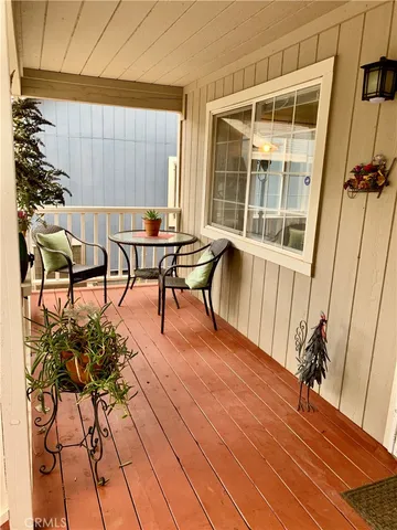 a view of a chairs and table in a patio