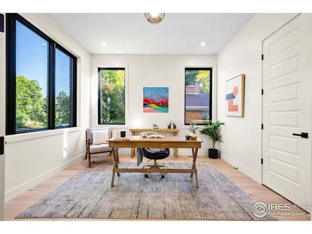 a balcony with furniture and garden view