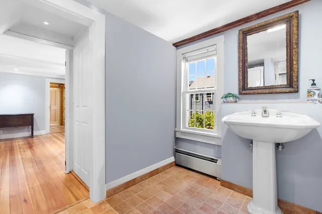 a view of bathroom with a sink and a mirror