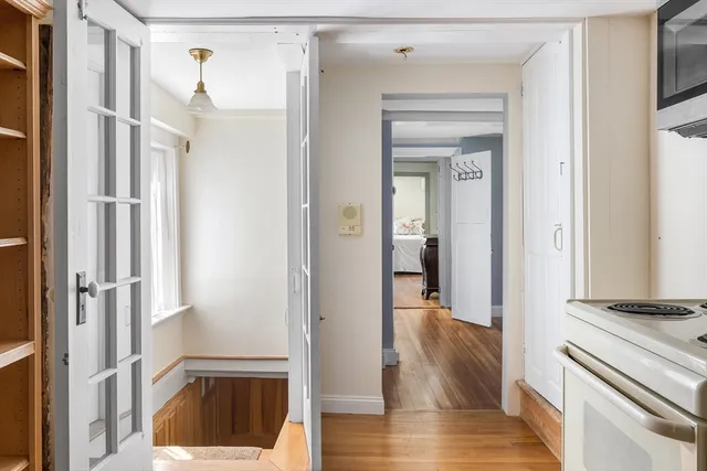 a kitchen with stainless steel appliances a stove microwave and sink