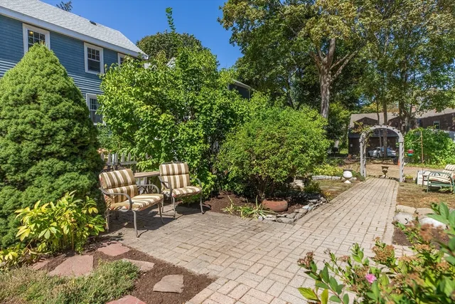 an aerial view of house with yard swimming pool and outdoor seating