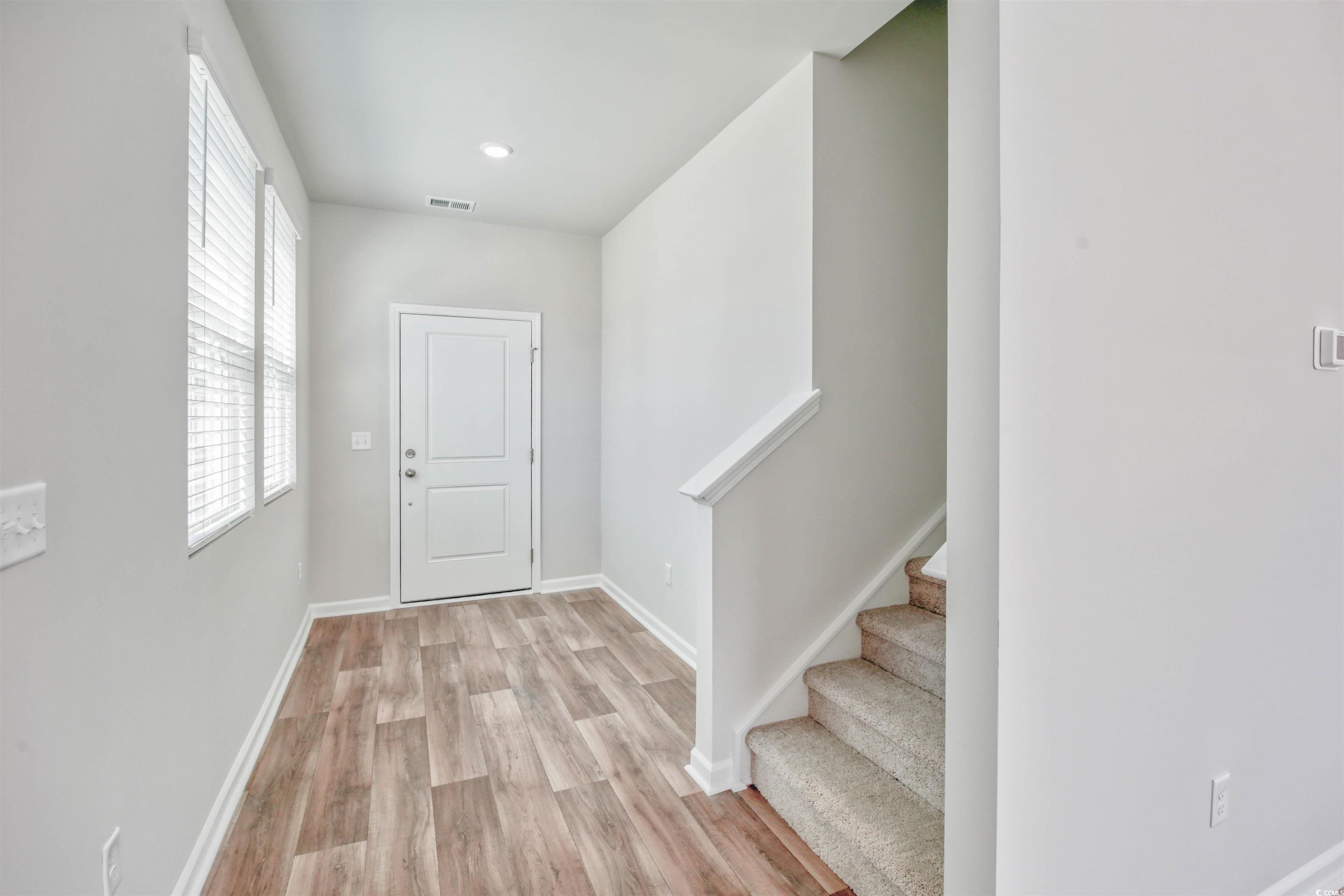 736 Sturdy Root Place Myrtle Beach, SC 29588 - Photo 12 of 15 Entryway featuring stairs, light wood-style flooring, and recessed lighting