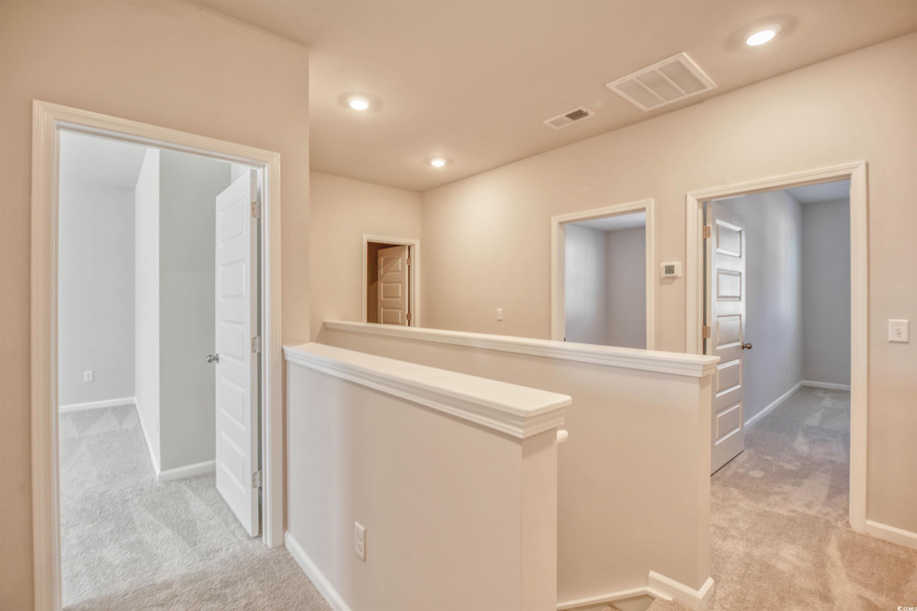 736 Sturdy Root Place Myrtle Beach, SC 29588 - Photo 3 of 15 Corridor with an upstairs landing, light colored carpet, and recessed lighting