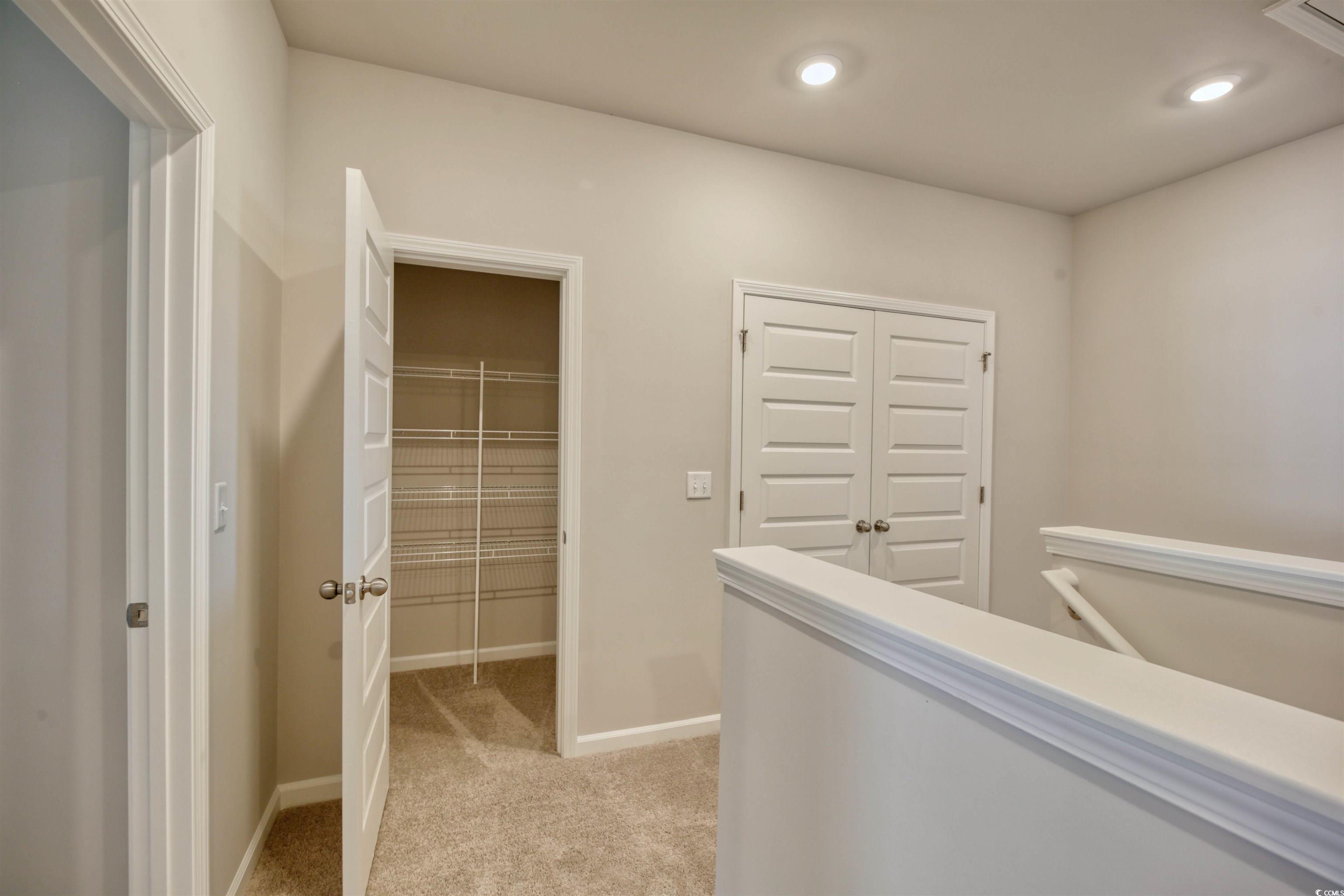 736 Sturdy Root Place Myrtle Beach, SC 29588 - Photo 6 of 15 Corridor featuring an upstairs landing, light carpet, and recessed lighting