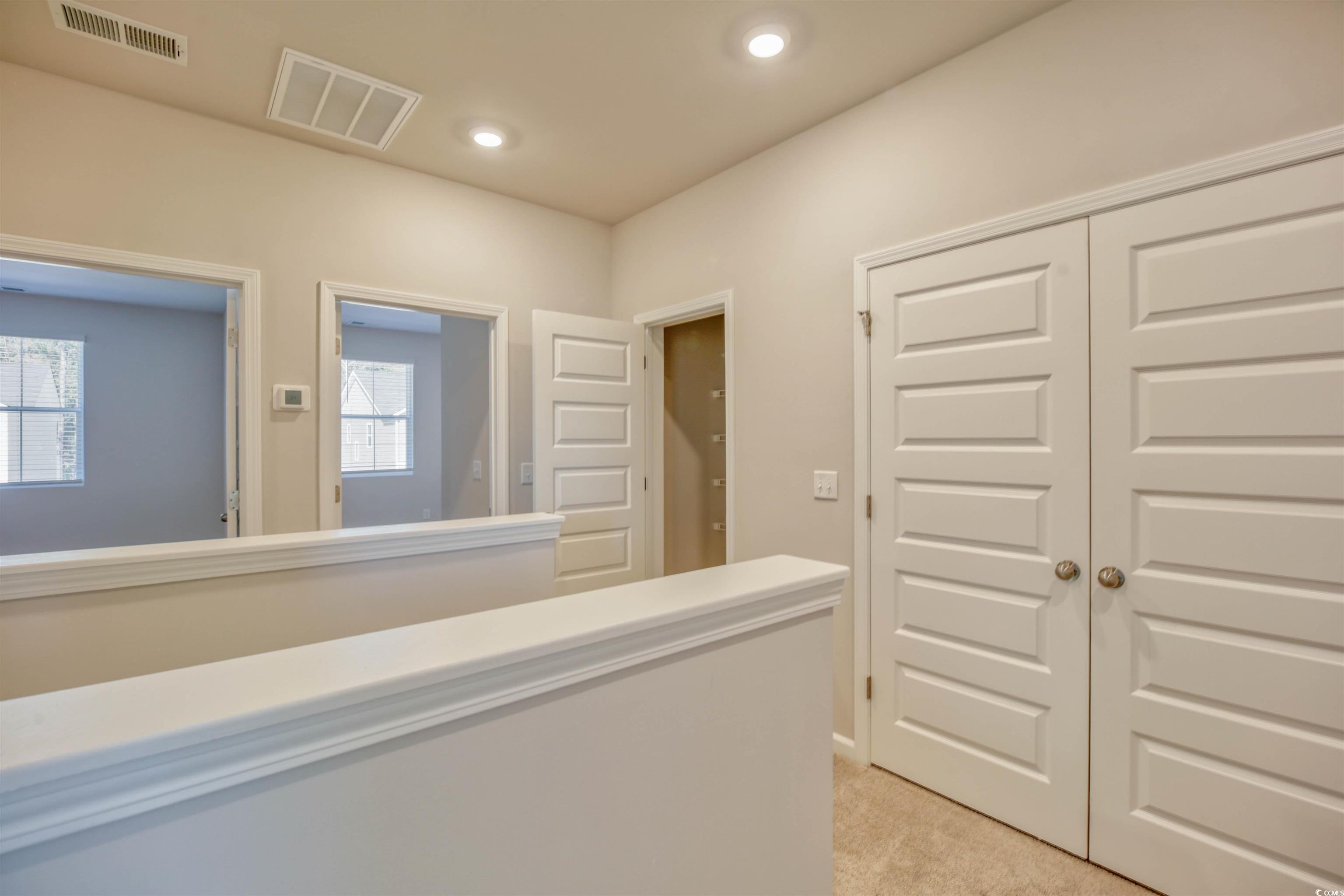 736 Sturdy Root Place Myrtle Beach, SC 29588 - Photo 7 of 15 Hallway featuring light colored carpet and recessed lighting