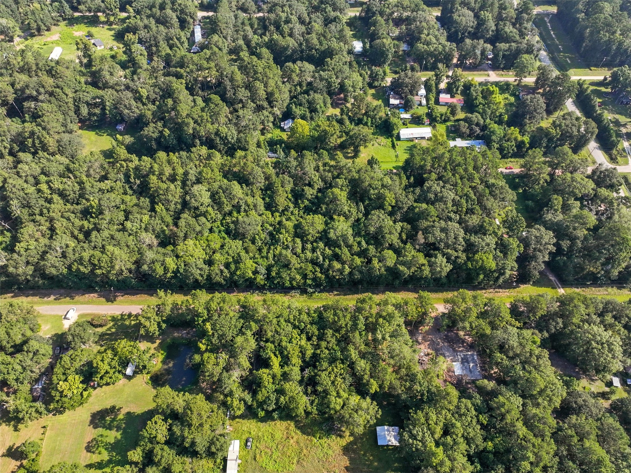 0 Dora Lane Shepherd, TX 77371 - Photo 2 of 5 a view of a bunch of trees and bushes