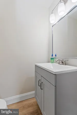 a bathroom with a sink and vanity