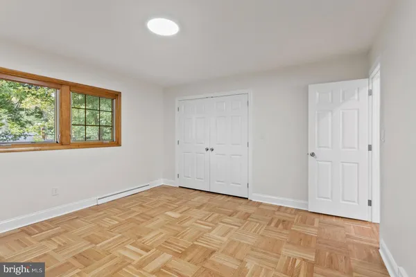 a view of an empty room with a window