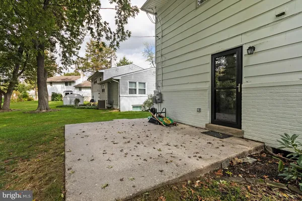a front view of house with yard and trees