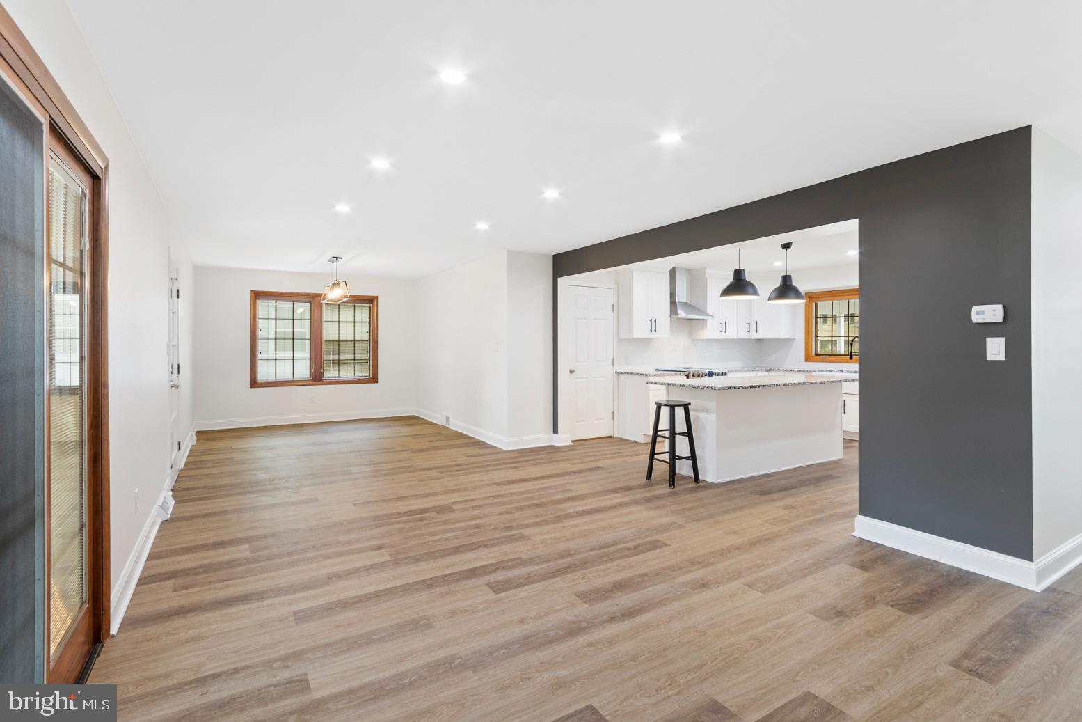 2106 Largo Road Wilmington, DE 19803 - Photo 6 of 30 a view of an empty room with wooden floor and windows