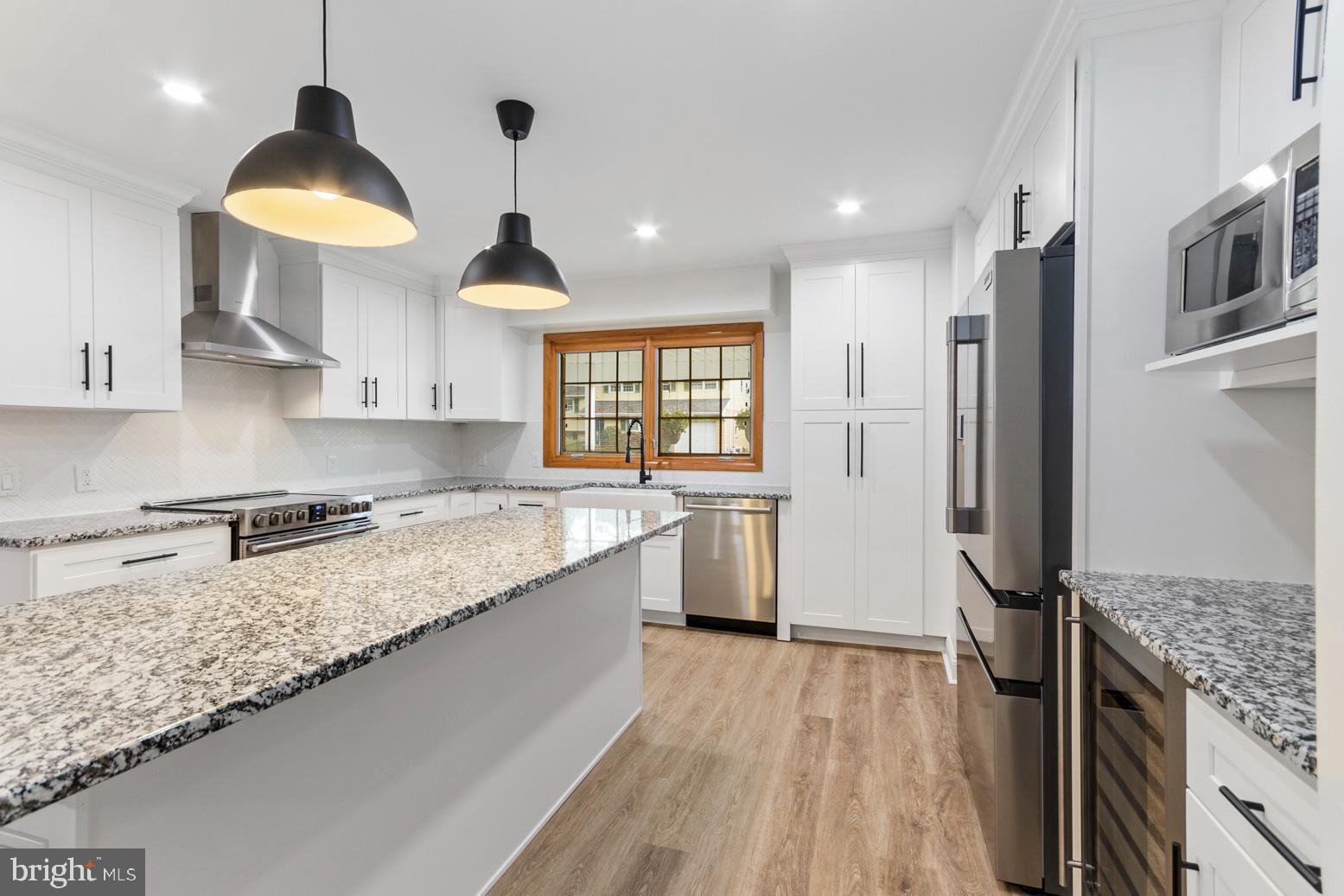 2106 Largo Road Wilmington, DE 19803 - Photo 9 of 30 a kitchen with stainless steel appliances granite countertop a sink stove and refrigerator