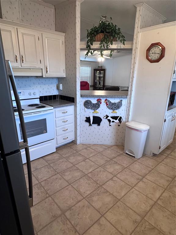 307 West Division Street Graford, TX 76449 - Photo 15 of 22 a kitchen with stainless steel appliances a stove a microwave and a refrigerator