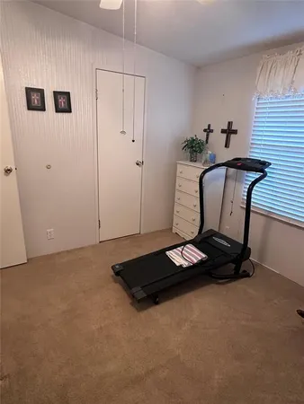 a bathroom with a toilet and a shower curtain