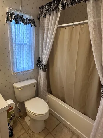 a bedroom with a bed and a cabinets