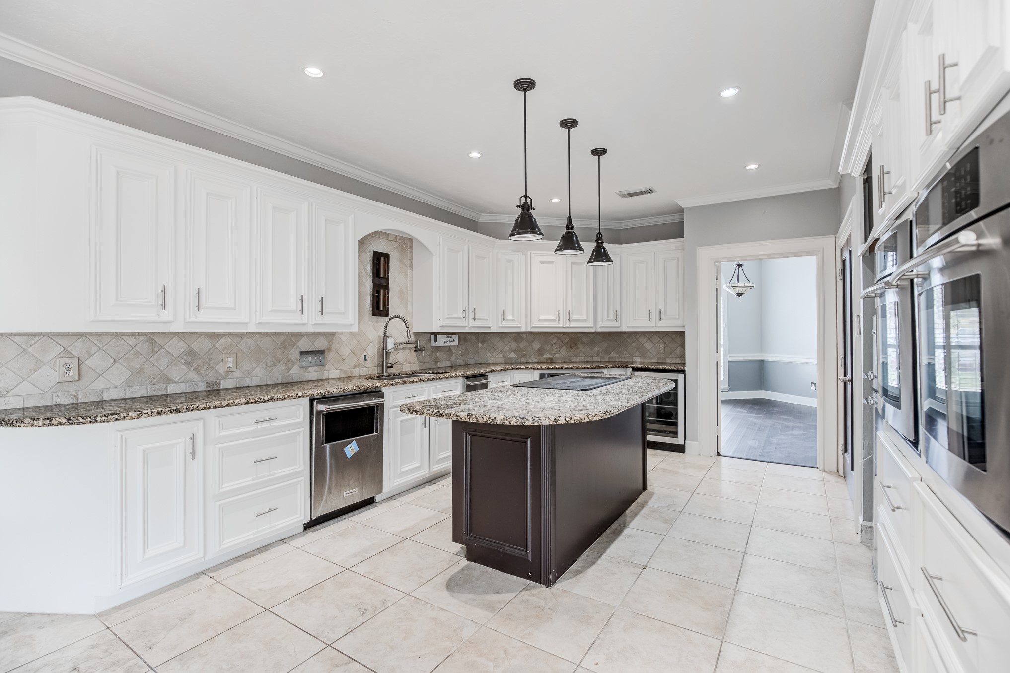 11618 Snowmass Drive Houston, TX 77070 - Photo 13 of 36 a kitchen with a sink stove and cabinets