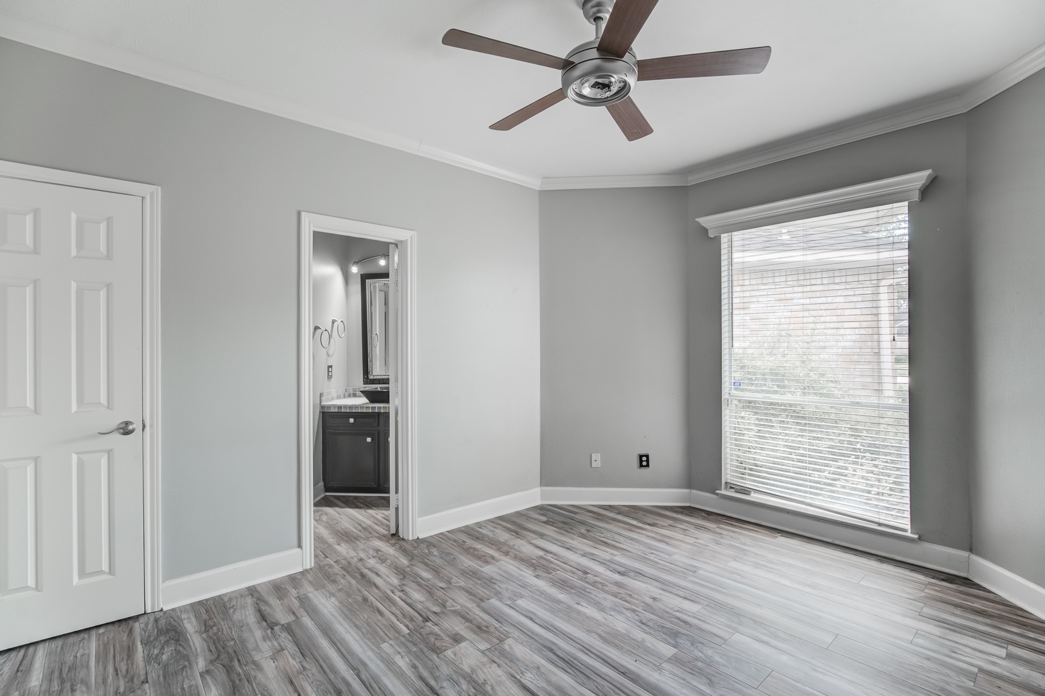11618 Snowmass Drive Houston, TX 77070 - Photo 30 of 36 a view of empty room with wooden floor and fan