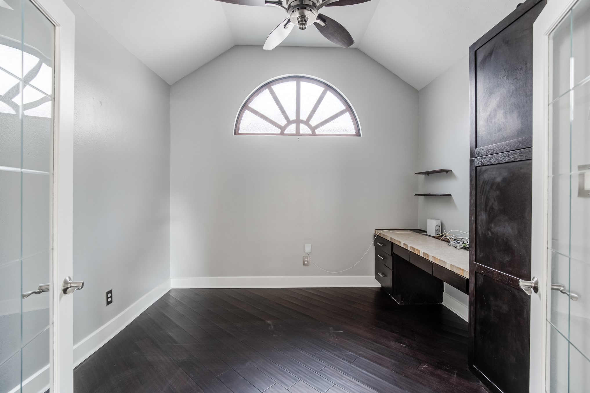 11618 Snowmass Drive Houston, TX 77070 - Photo 6 of 36 an empty room with a window and wooden floor