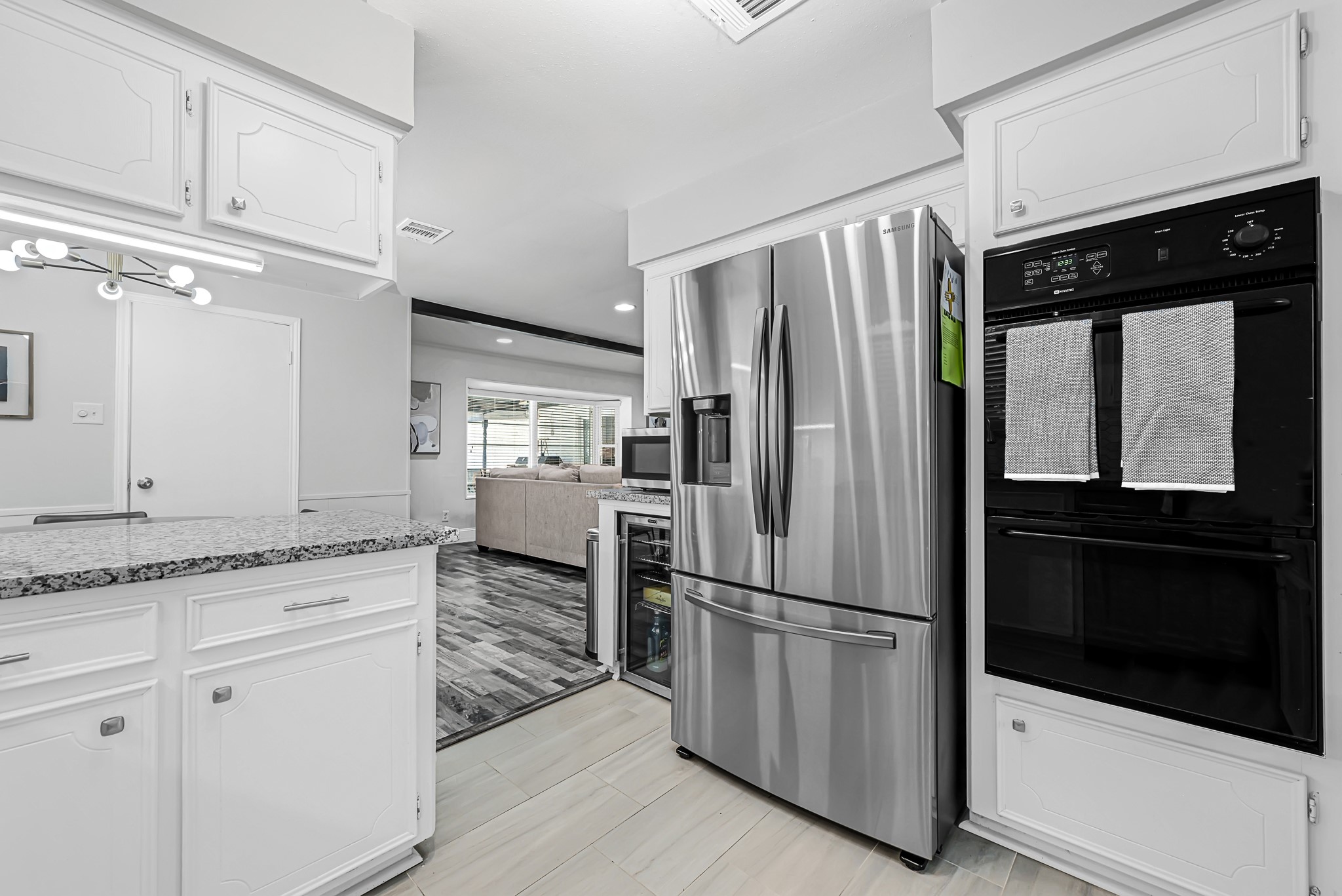 25418 Tuckahoe Lane Spring, TX 77373 - Photo 11 of 26 a kitchen with granite countertop stainless steel appliances a refrigerator a stove and cabinets