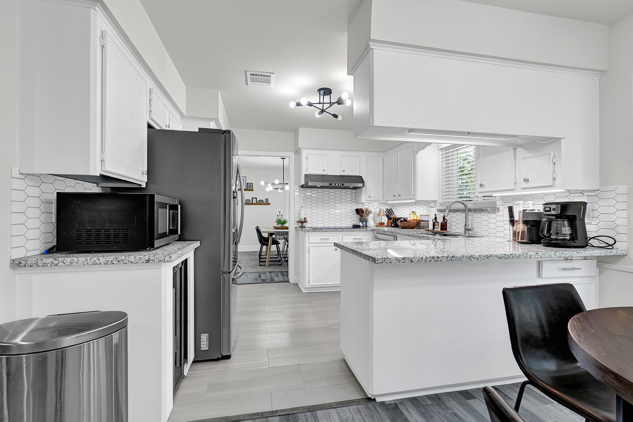 25418 Tuckahoe Lane Spring, TX 77373 - Photo 13 of 26 a kitchen with stainless steel appliances a stove a sink a microwave a refrigerator and cabinets