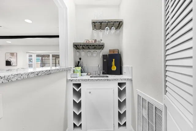 a kitchen with a sink and cabinets