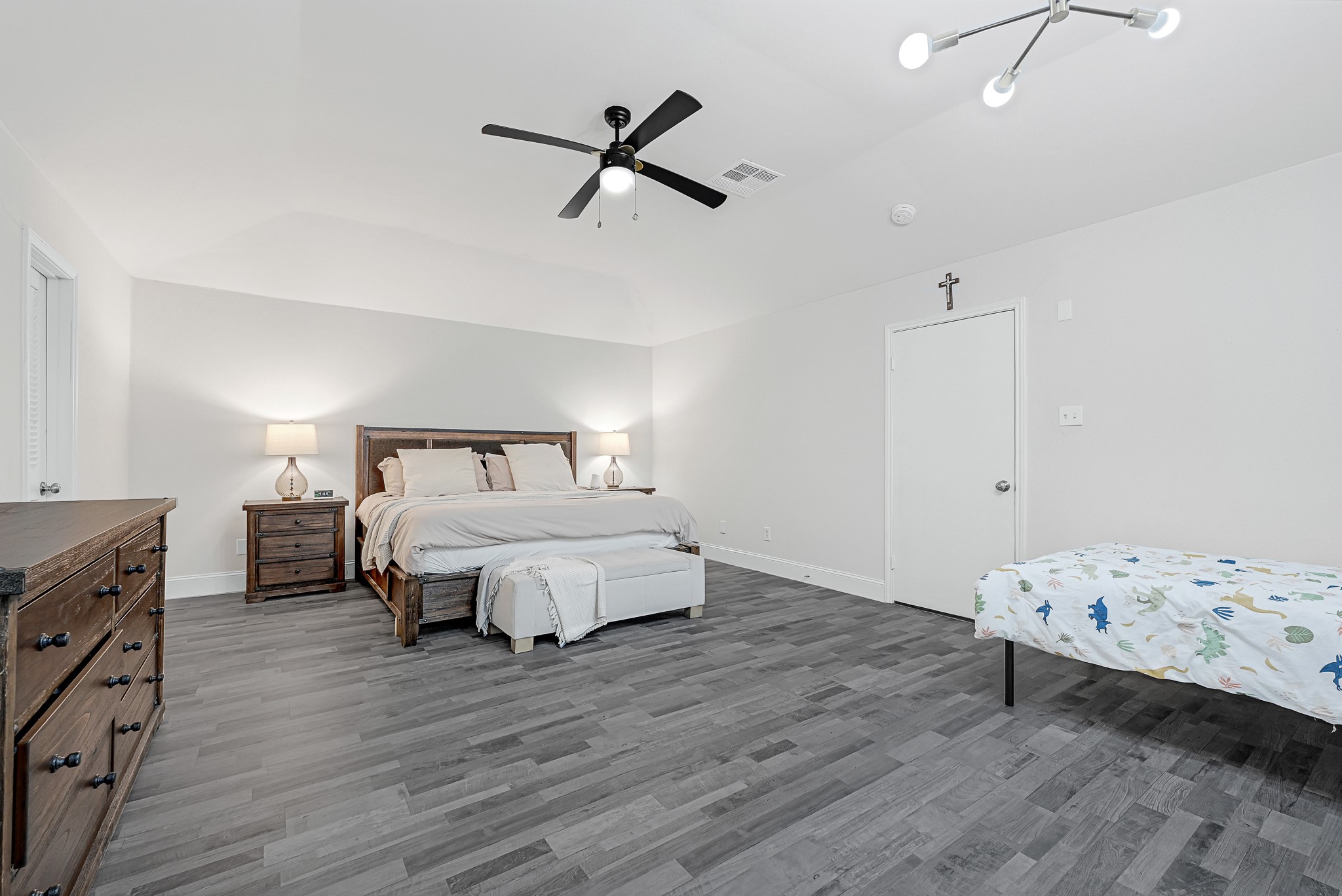 25418 Tuckahoe Lane Spring, TX 77373 - Photo 16 of 26 a bedroom with a bed and wooden floor