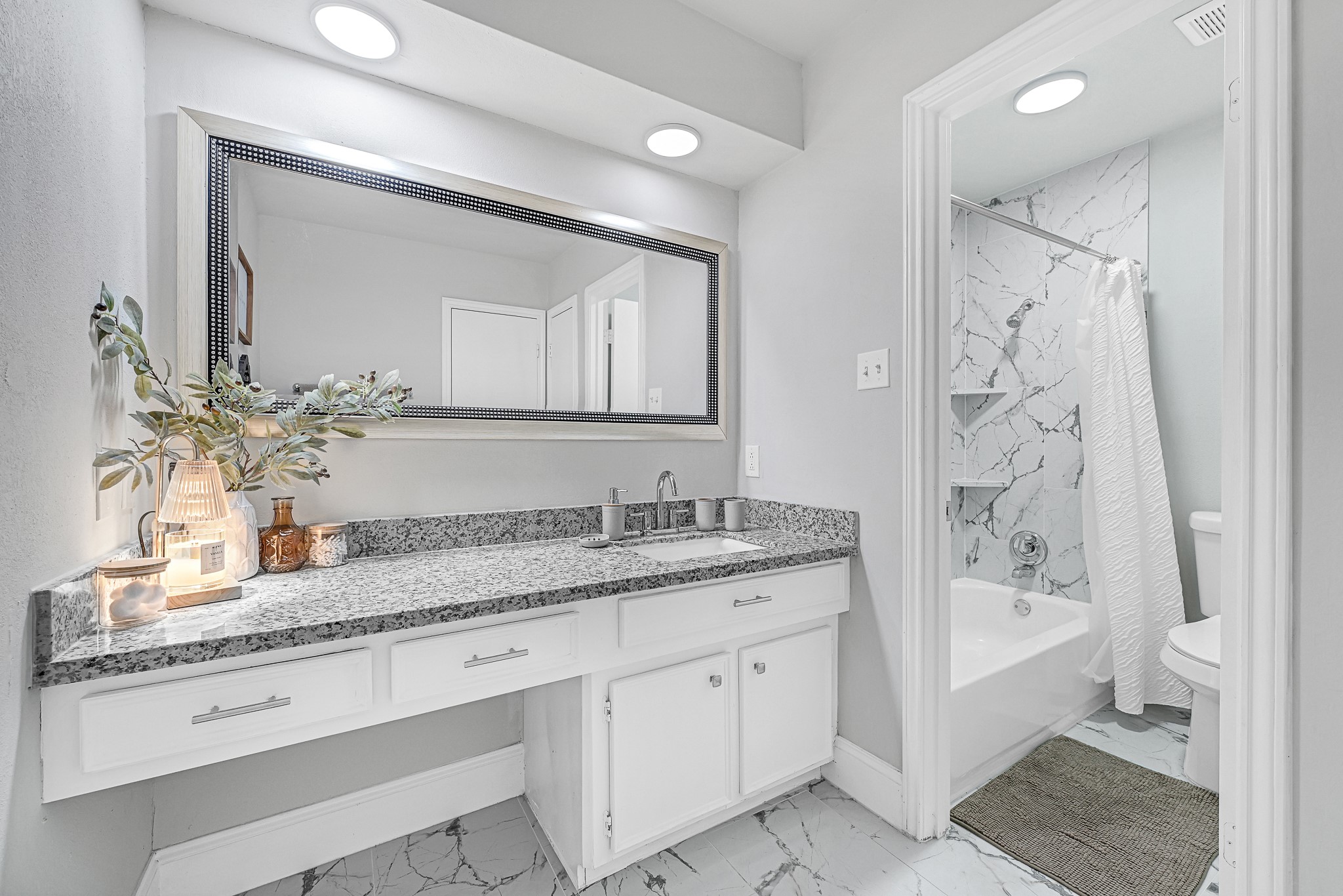 25418 Tuckahoe Lane Spring, TX 77373 - Photo 22 of 26 a bathroom with a granite countertop sink tub double and mirror