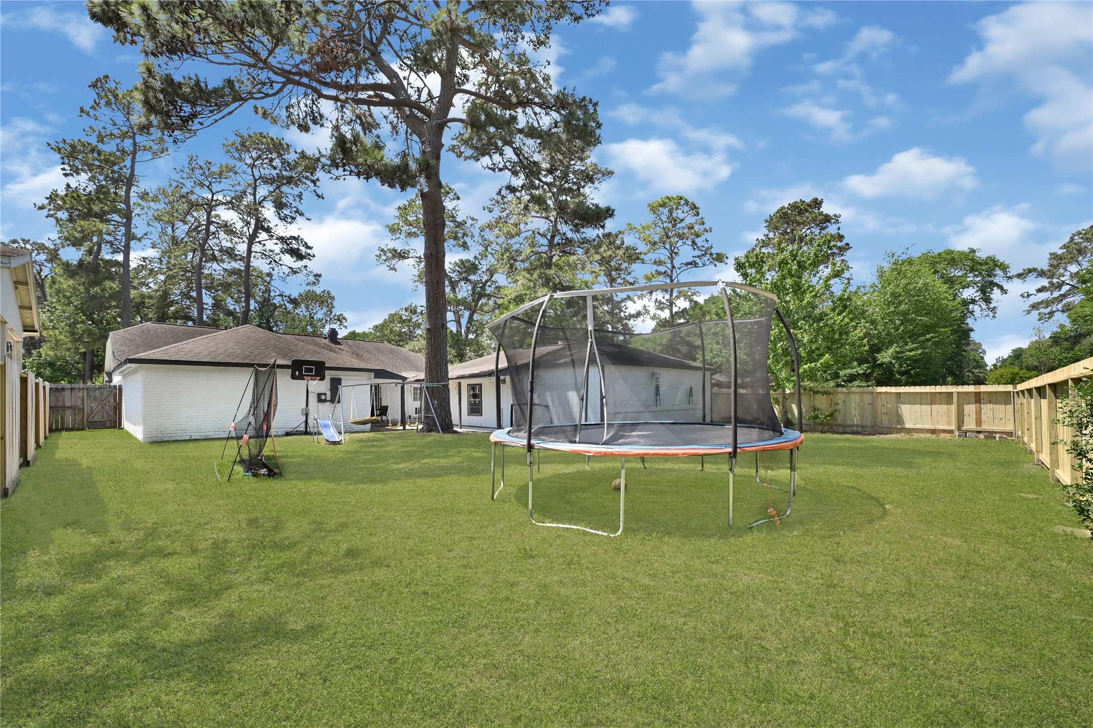 25418 Tuckahoe Lane Spring, TX 77373 - Photo 25 of 26 a view of a house with a backyard