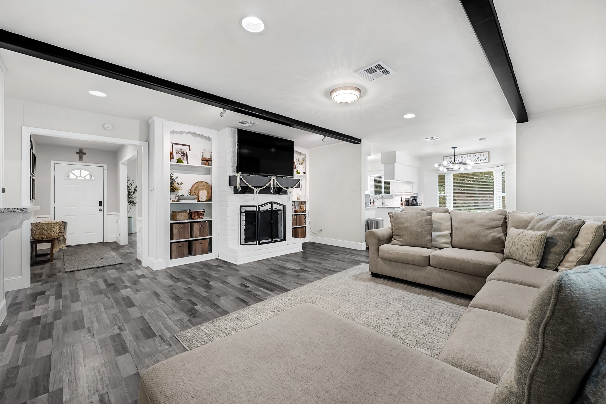 25418 Tuckahoe Lane Spring, TX 77373 - Photo 9 of 26 a living room with furniture and a flat screen tv
